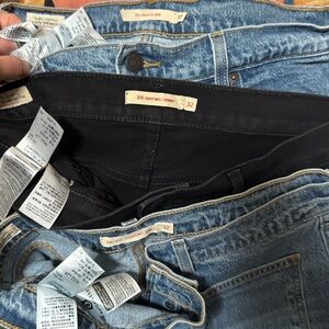 Three Levi’s size 32 jeans